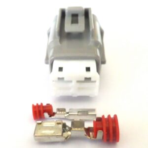 Close-up of a USB-A connector with metal plug and red cable insulation, viewed from above on a white background.